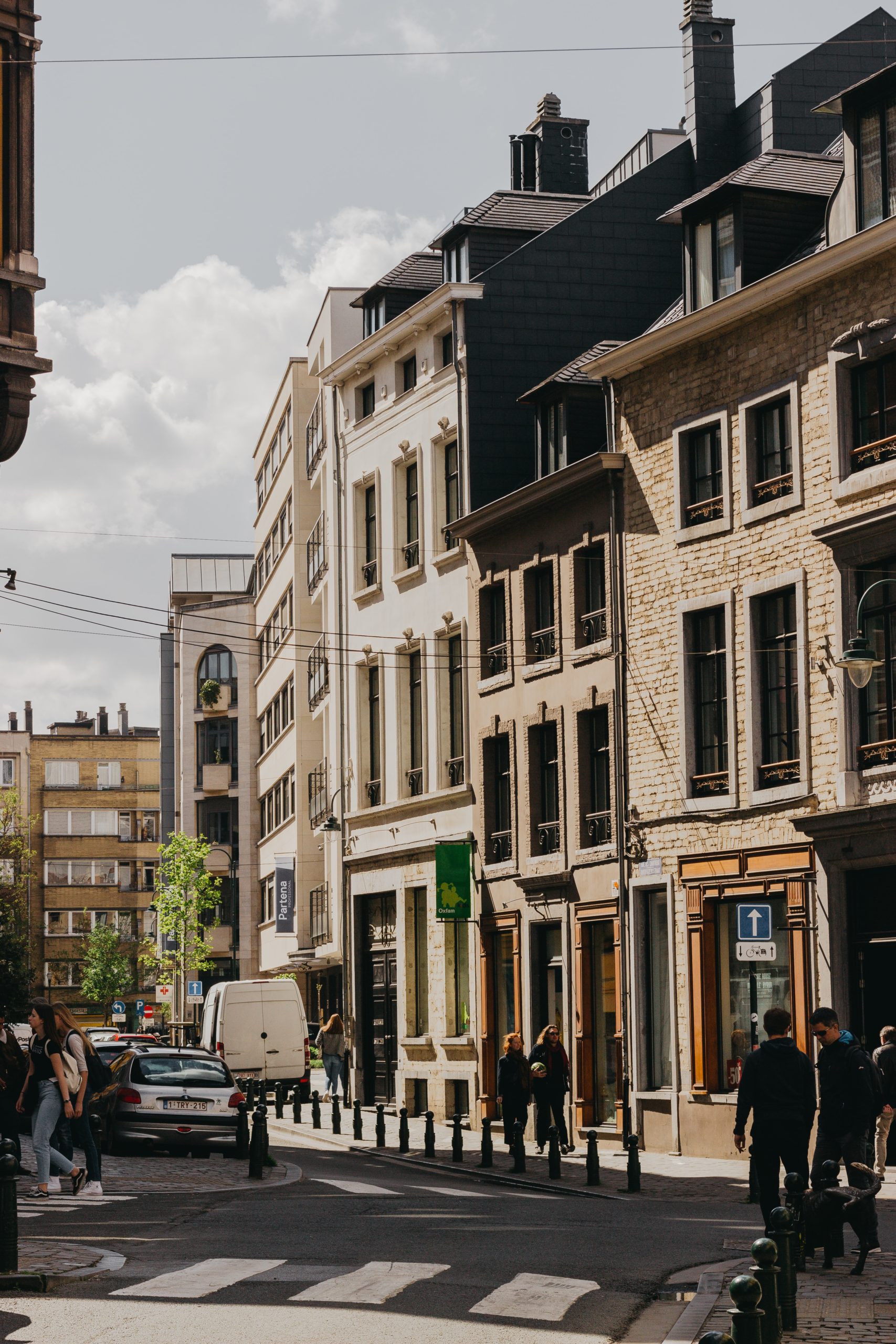 people walking beside building