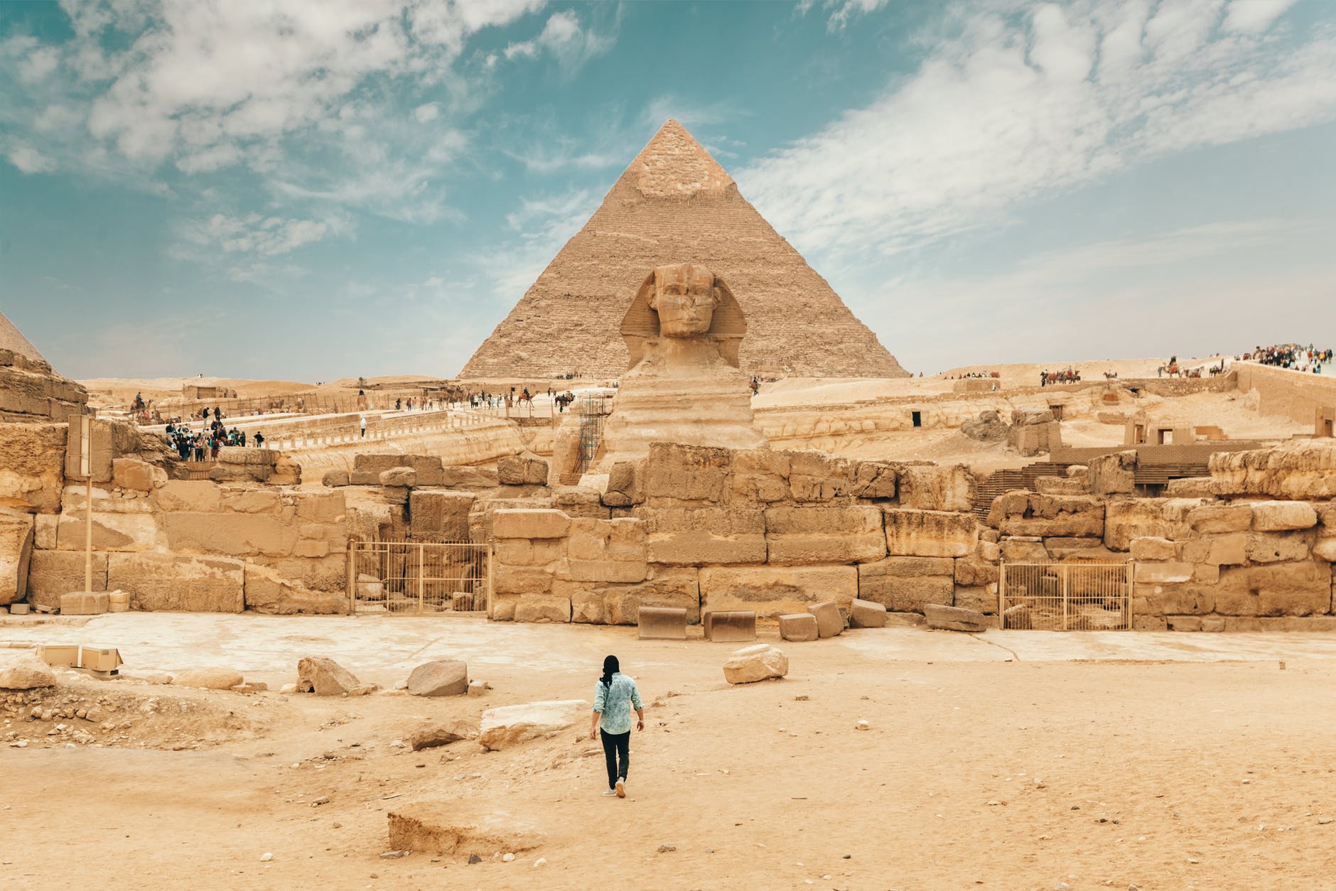 tourist walking towards historical architectural monument